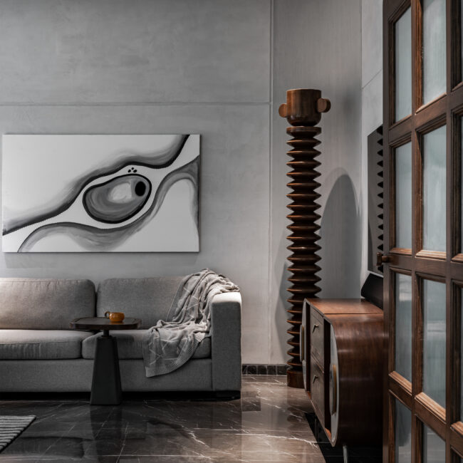 Cordkraft Design Studio’s LAAD-5 in Ahmedabad is a monochrome retreat defined by a handcrafted ceiling mural